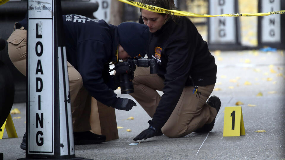 Police at the site of the fatal shooting of United Healthcare CEO Brian Thompson in Manhattan on December 04, 2024.